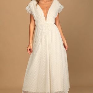 Lulu’s “Your Evermore Swiss Dot Ruffled” dress in cream
